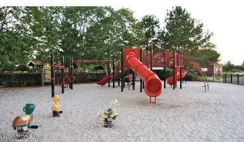 an aerial view of a tennis ground and a yard