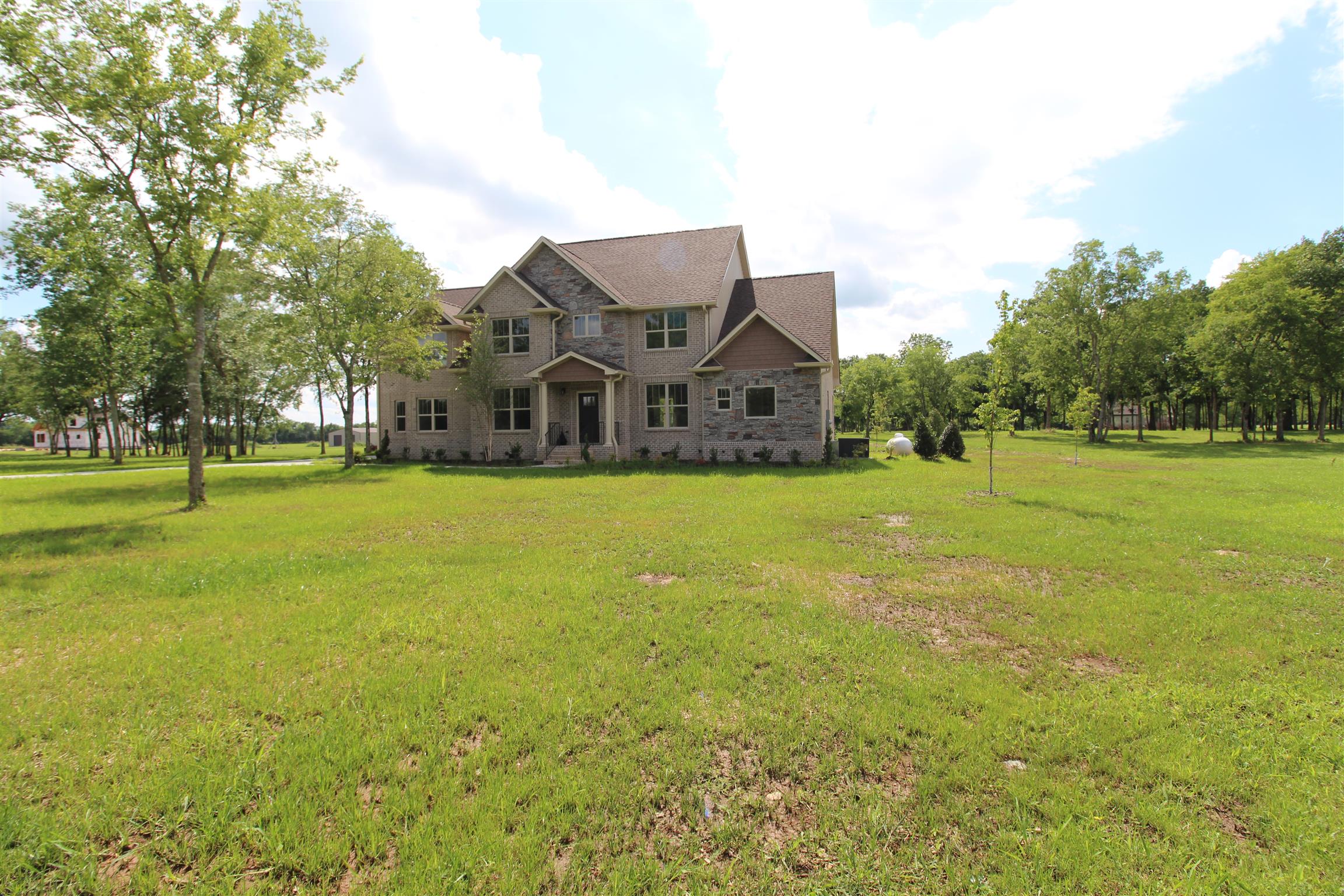 7150 Cedar Forest Road Lebanon, TN 37090 - Photo 2 of 29 a front view of a house with a big yard