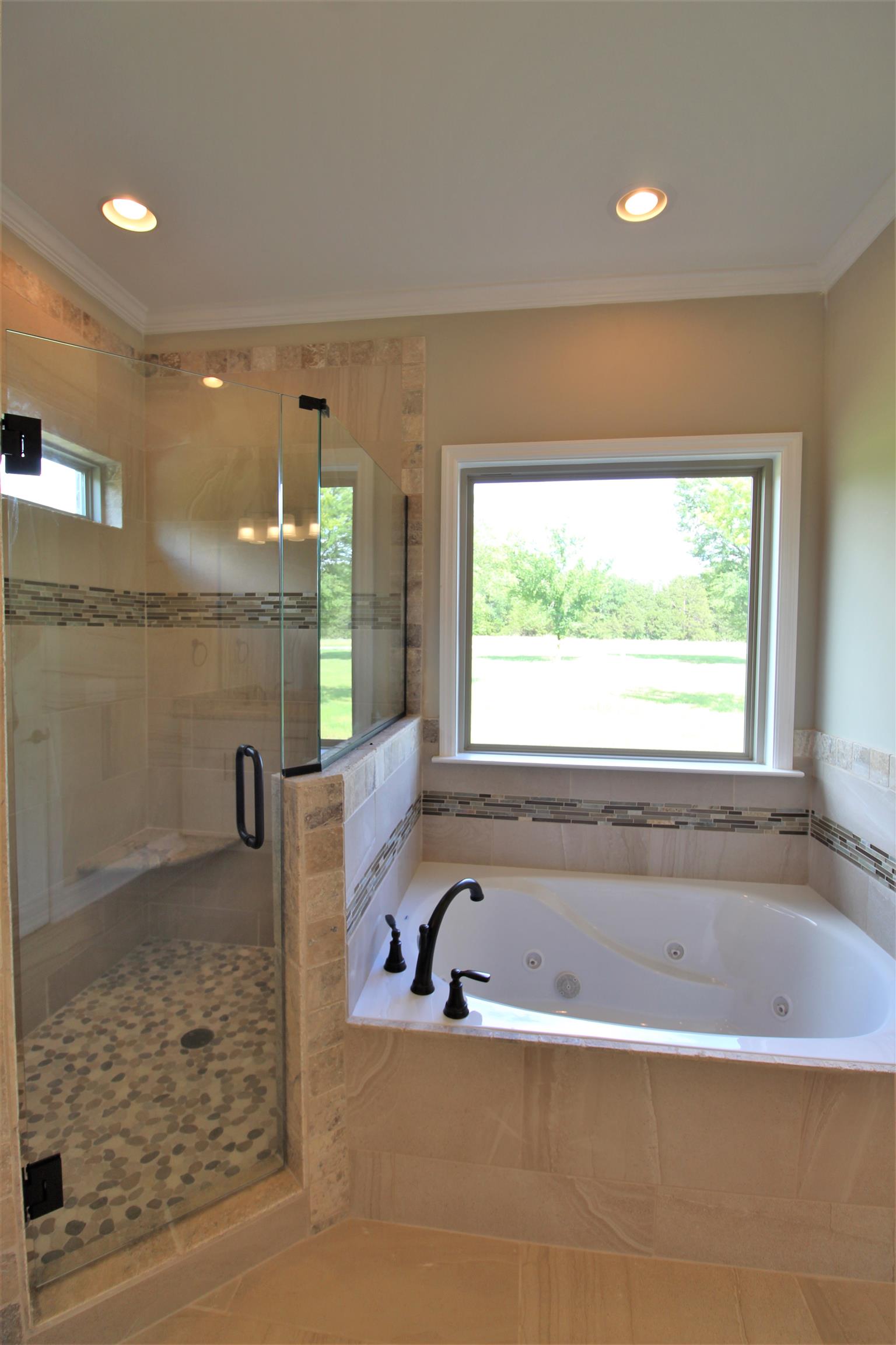 7150 Cedar Forest Road Lebanon, TN 37090 - Photo 15 of 29 a bathroom with a bathtub and a shower