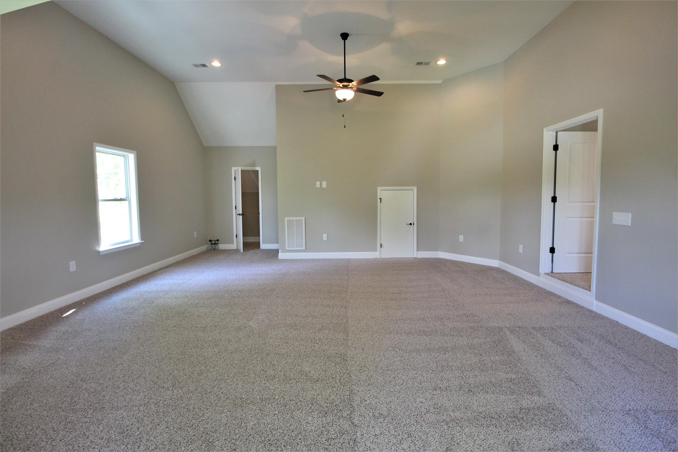 7150 Cedar Forest Road Lebanon, TN 37090 - Photo 23 of 29 en empty room with windows and fan