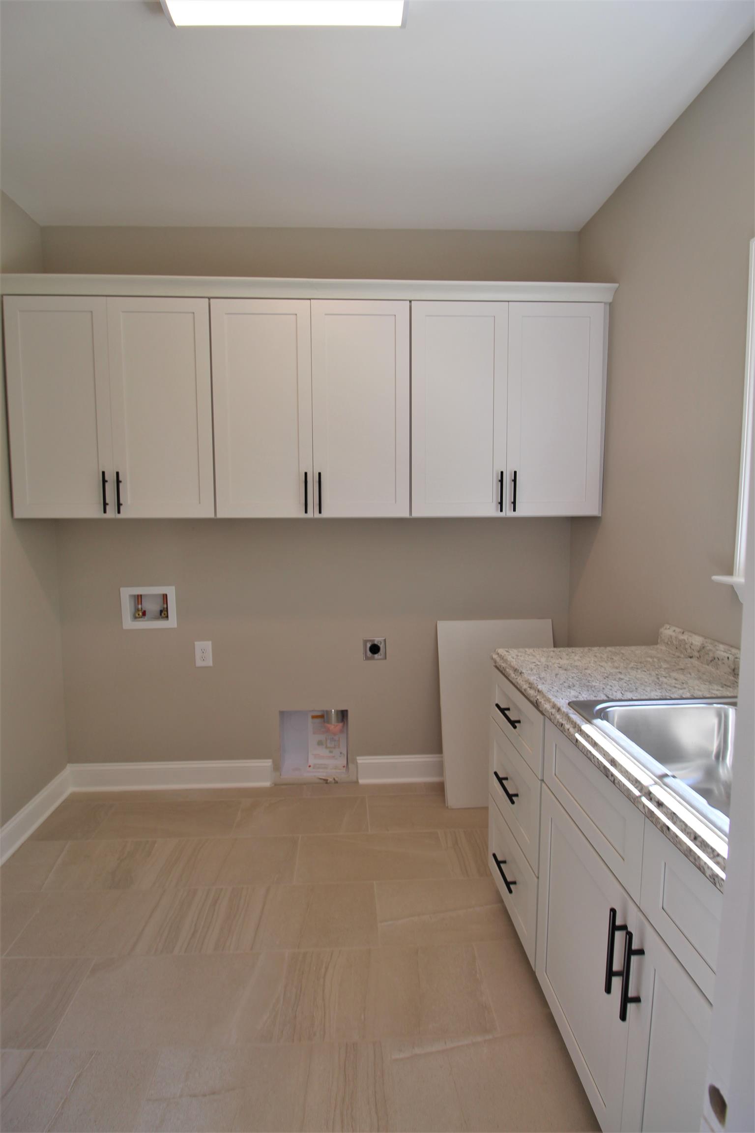 7150 Cedar Forest Road Lebanon, TN 37090 - Photo 26 of 29 a kitchen with a sink and cabinets