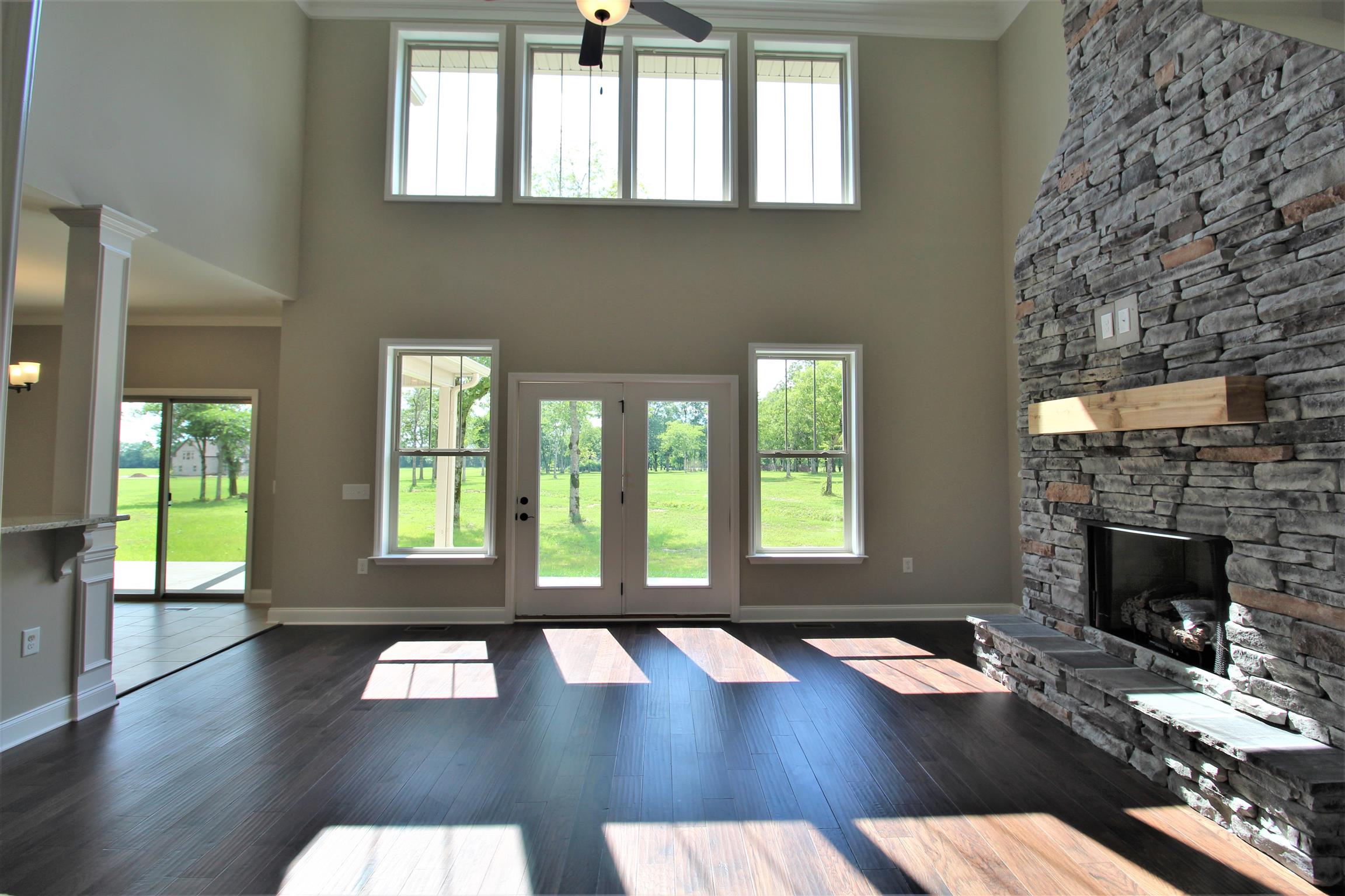 7150 Cedar Forest Road Lebanon, TN 37090 - Photo 5 of 29 a living room with hardwood floor and a fireplace