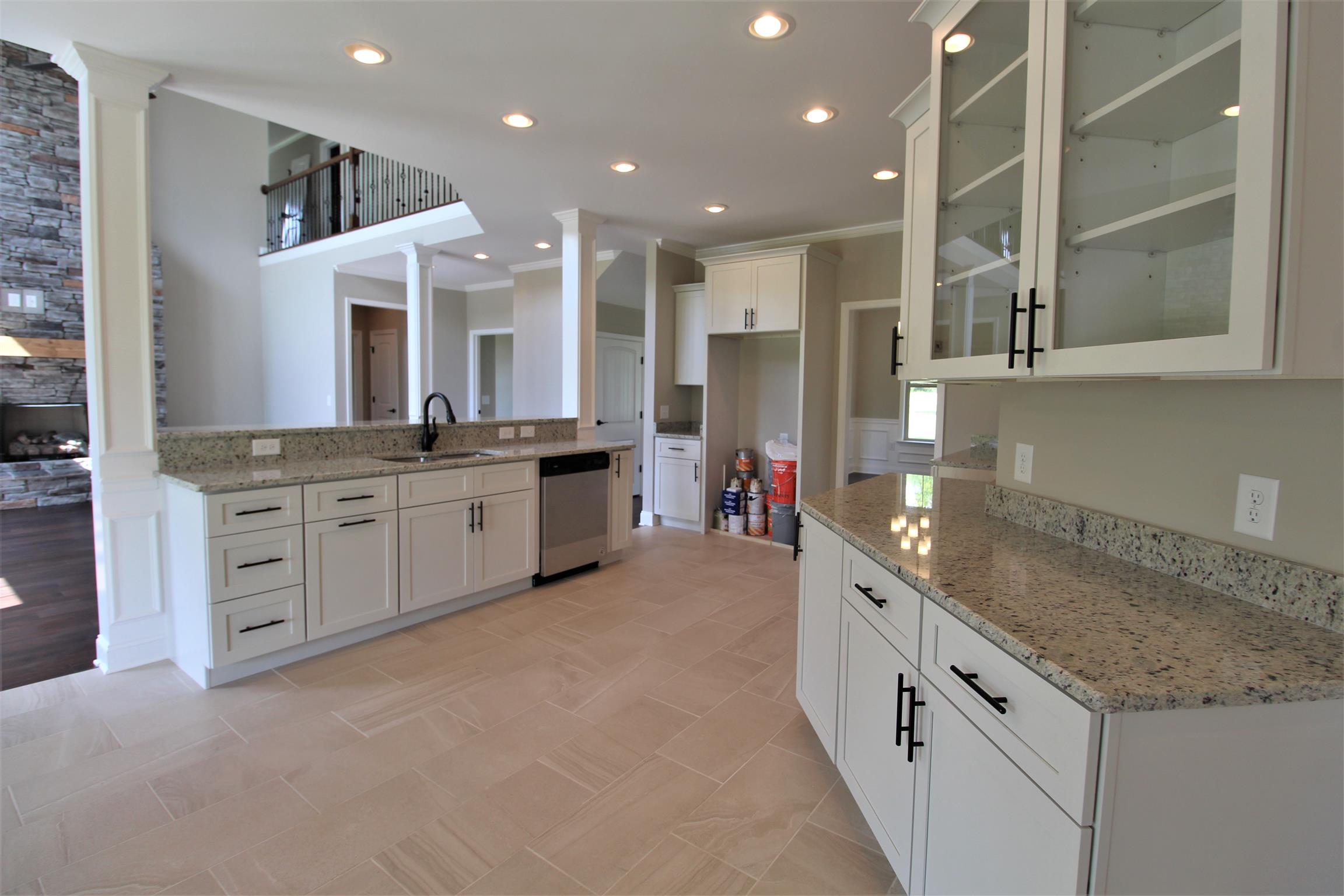 7150 Cedar Forest Road Lebanon, TN 37090 - Photo 8 of 29 a large kitchen with stainless steel appliances kitchen island granite countertop a sink and cabinets