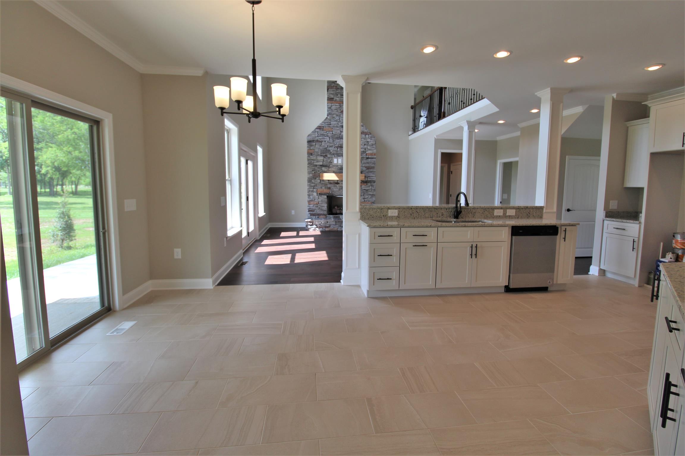 7150 Cedar Forest Road Lebanon, TN 37090 - Photo 9 of 29 a view of kitchen with stainless steel appliances granite countertop cabinets and fireplace