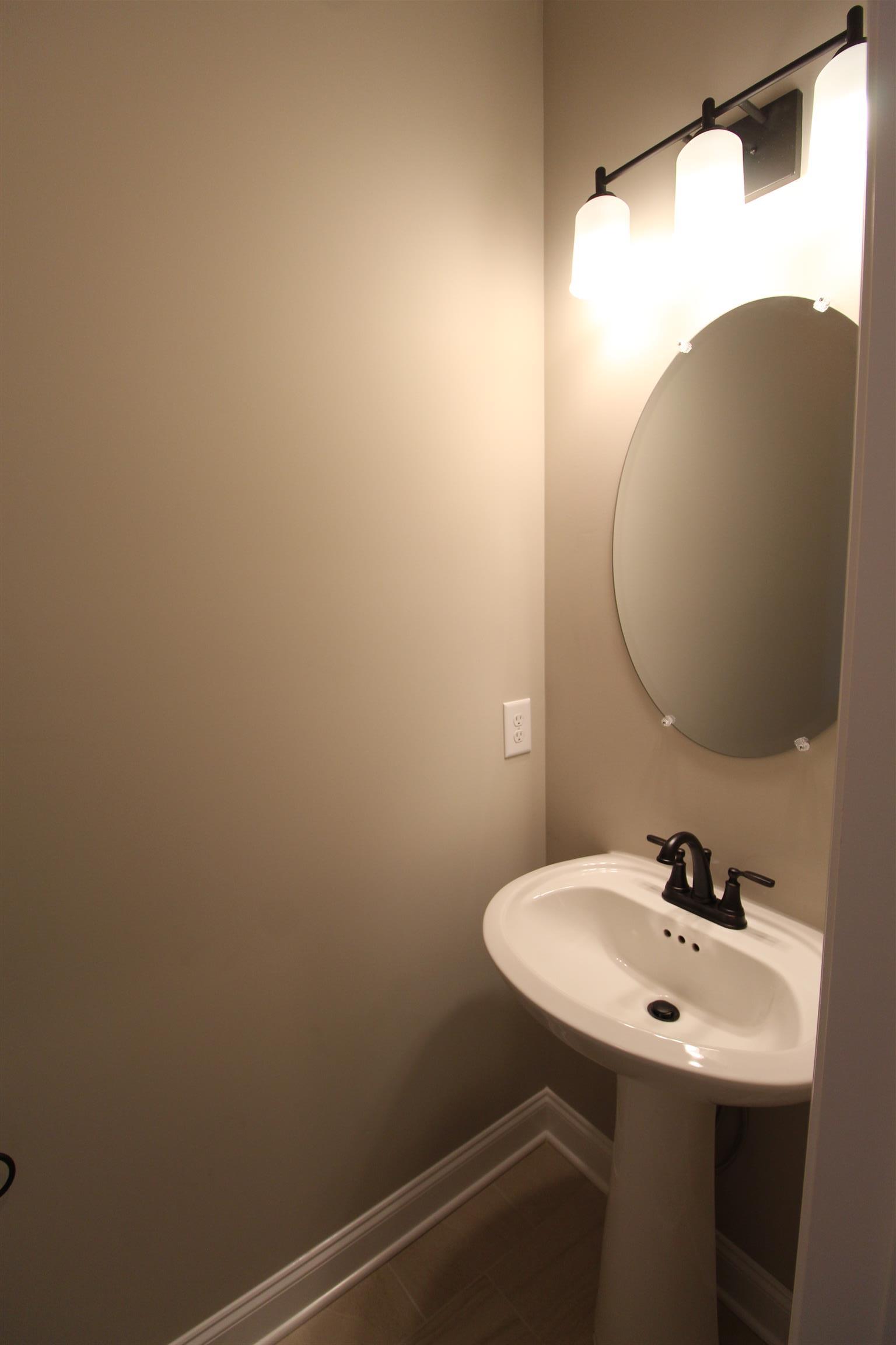 7150 Cedar Forest Road Lebanon, TN 37090 - Photo 10 of 29 a bathroom with a sink and mirror