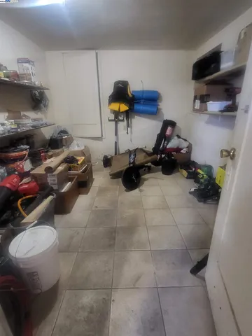 a room with gym equipment and a view of living room