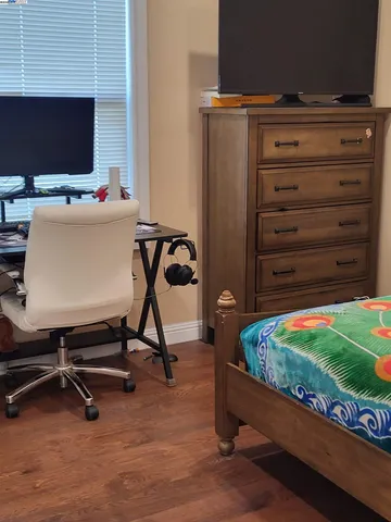 a room with furniture and a flat screen tv