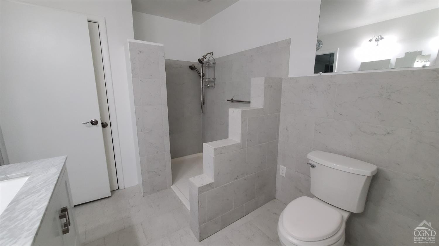 492 Cairo Junction Road Catskill, NY 12414 - Photo 13 of 34 a white toilet sitting next to a bathroom sink and vanity