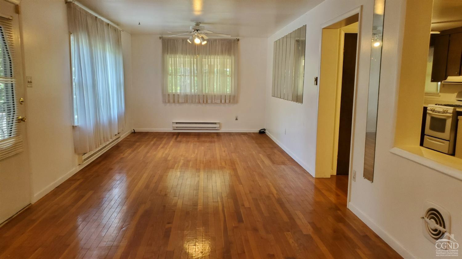 492 Cairo Junction Road Catskill, NY 12414 - Photo 3 of 34 a view of an empty room with wooden floor and a window