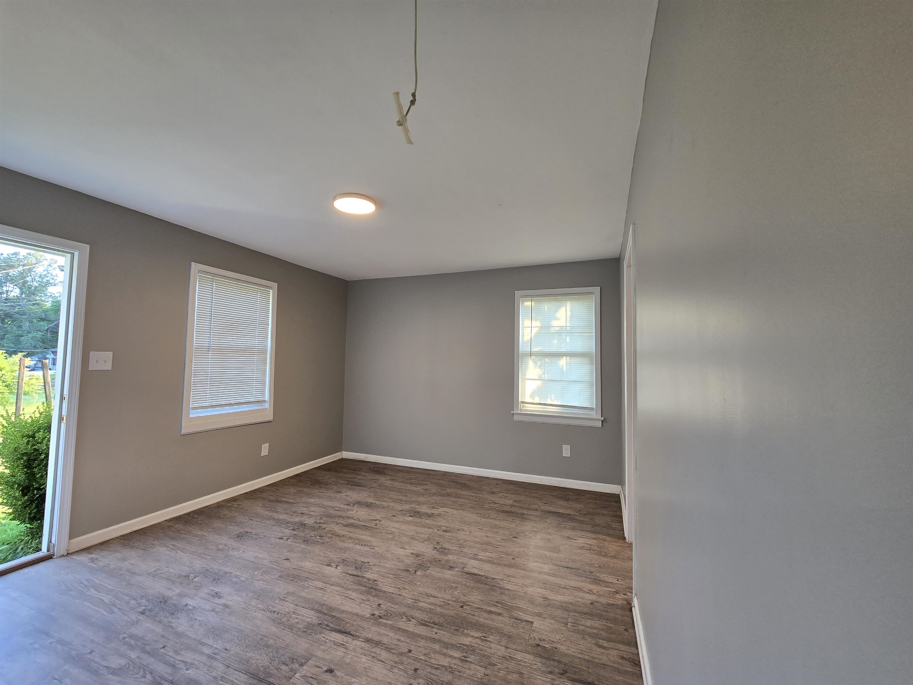 1572 Hanauer Street Memphis, TN 38109 - Photo 12 of 39 Spare room featuring dark wood-style floors and baseboards