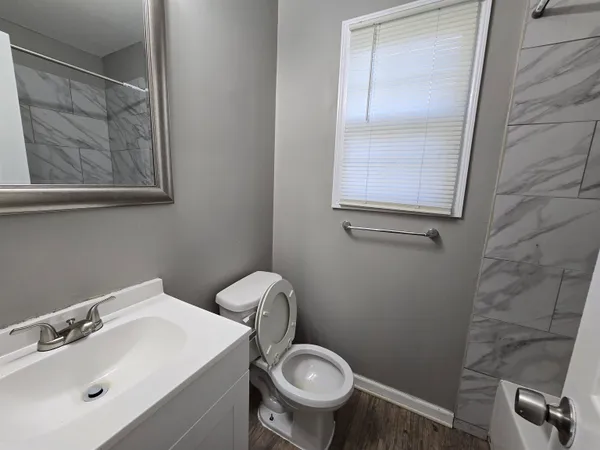 a bathroom with a toilet and a sink