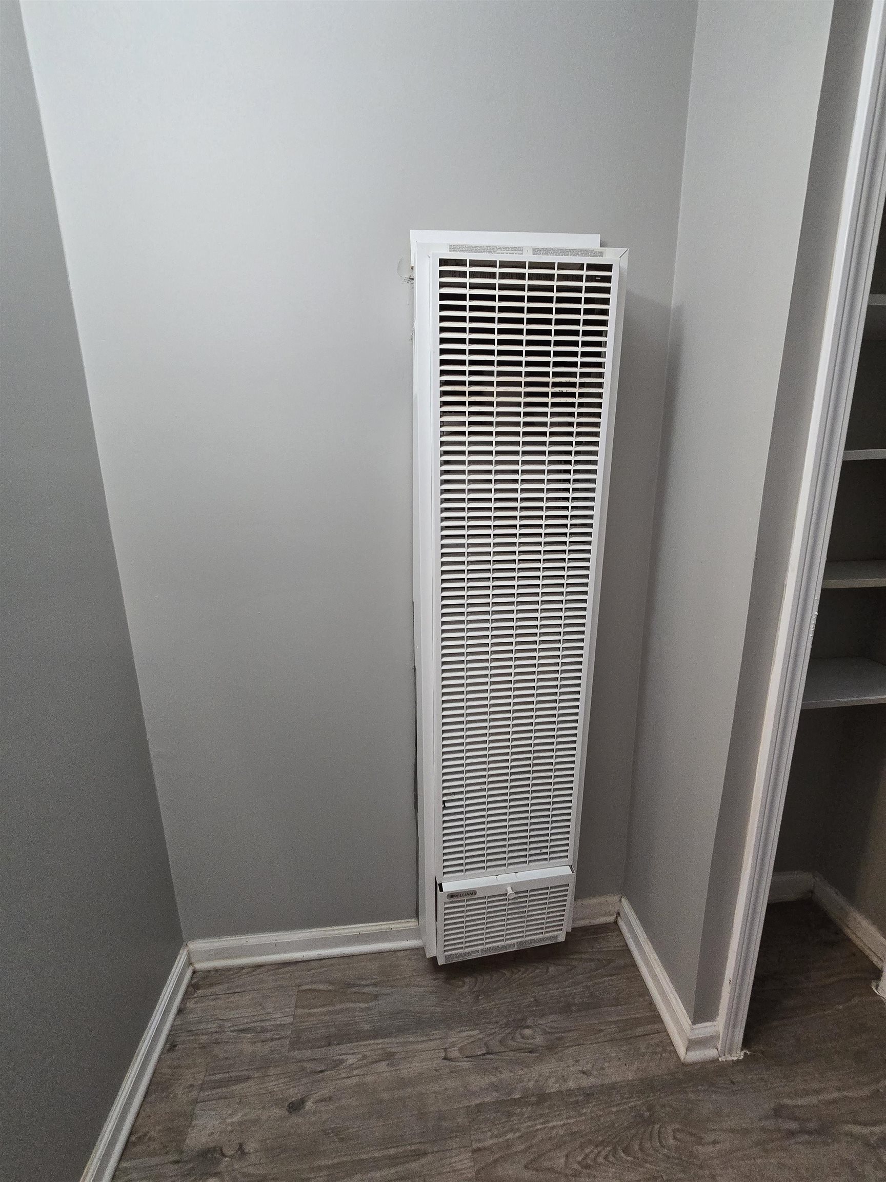 1572 Hanauer Street Memphis, TN 38109 - Photo 32 of 39 Detailed view of a heating unit, wood finished floors, and baseboards