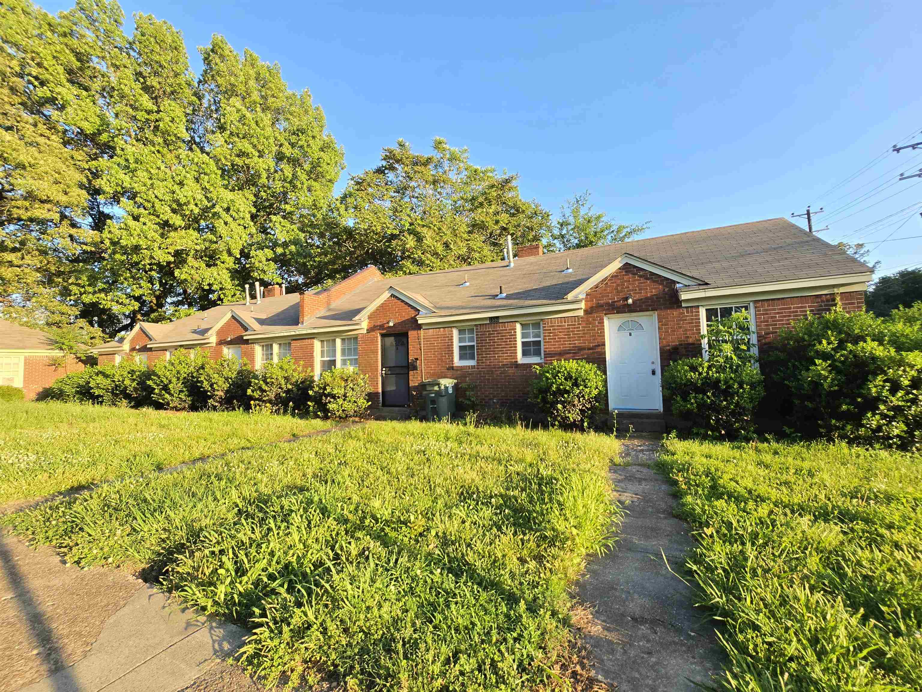 1572 Hanauer Street Memphis, TN 38109 - Photo 4 of 39 a front view of a house with a yard