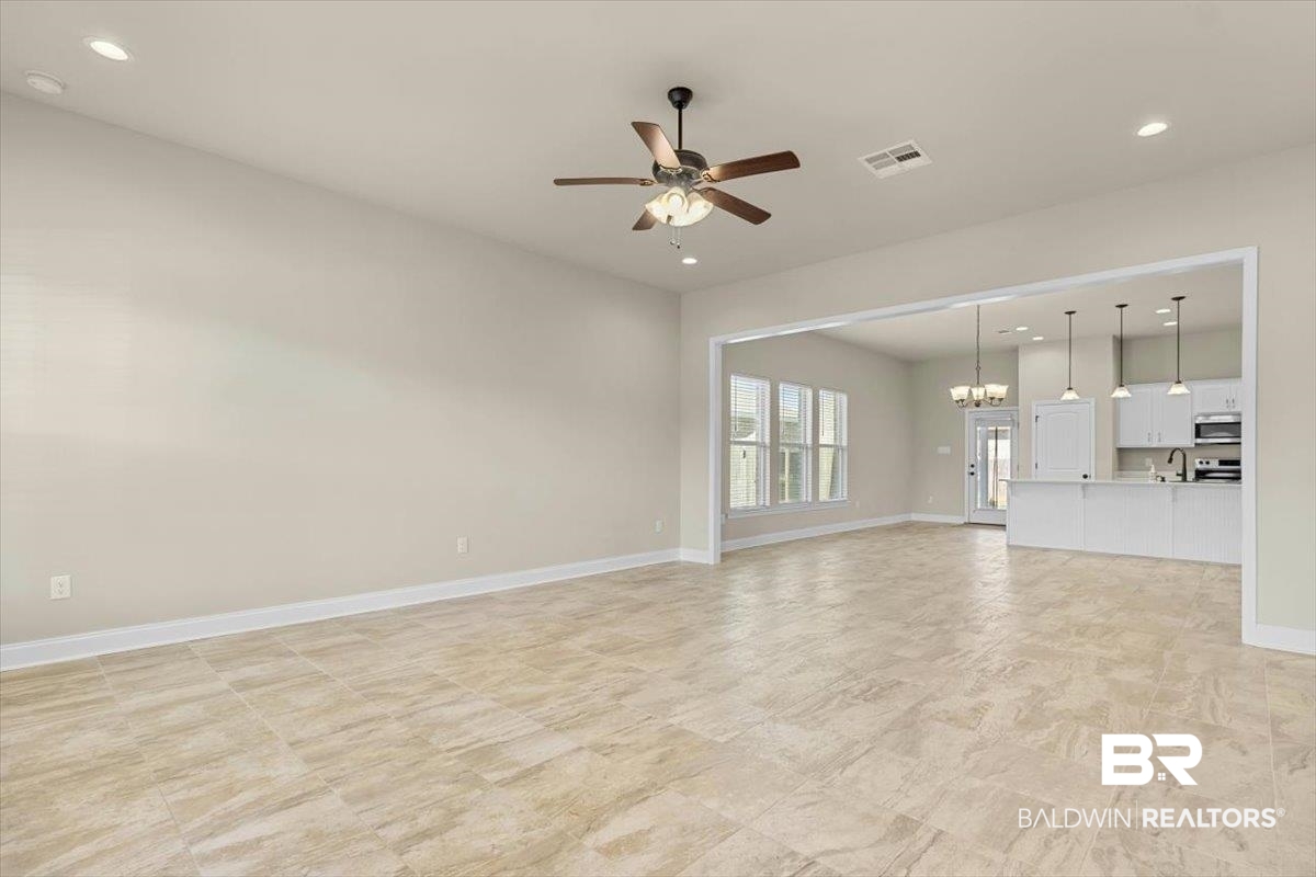 1112 Stella Road Foley, AL 36535 - Photo 4 of 33 Unfurnished living room with ceiling fan and suspended lighting
