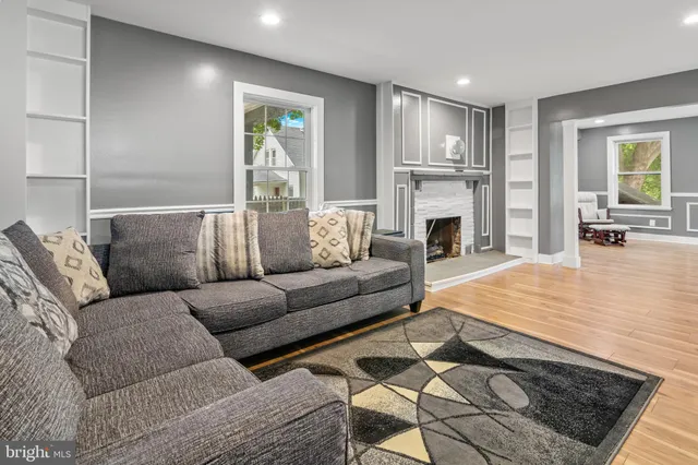 a living room with furniture and a table