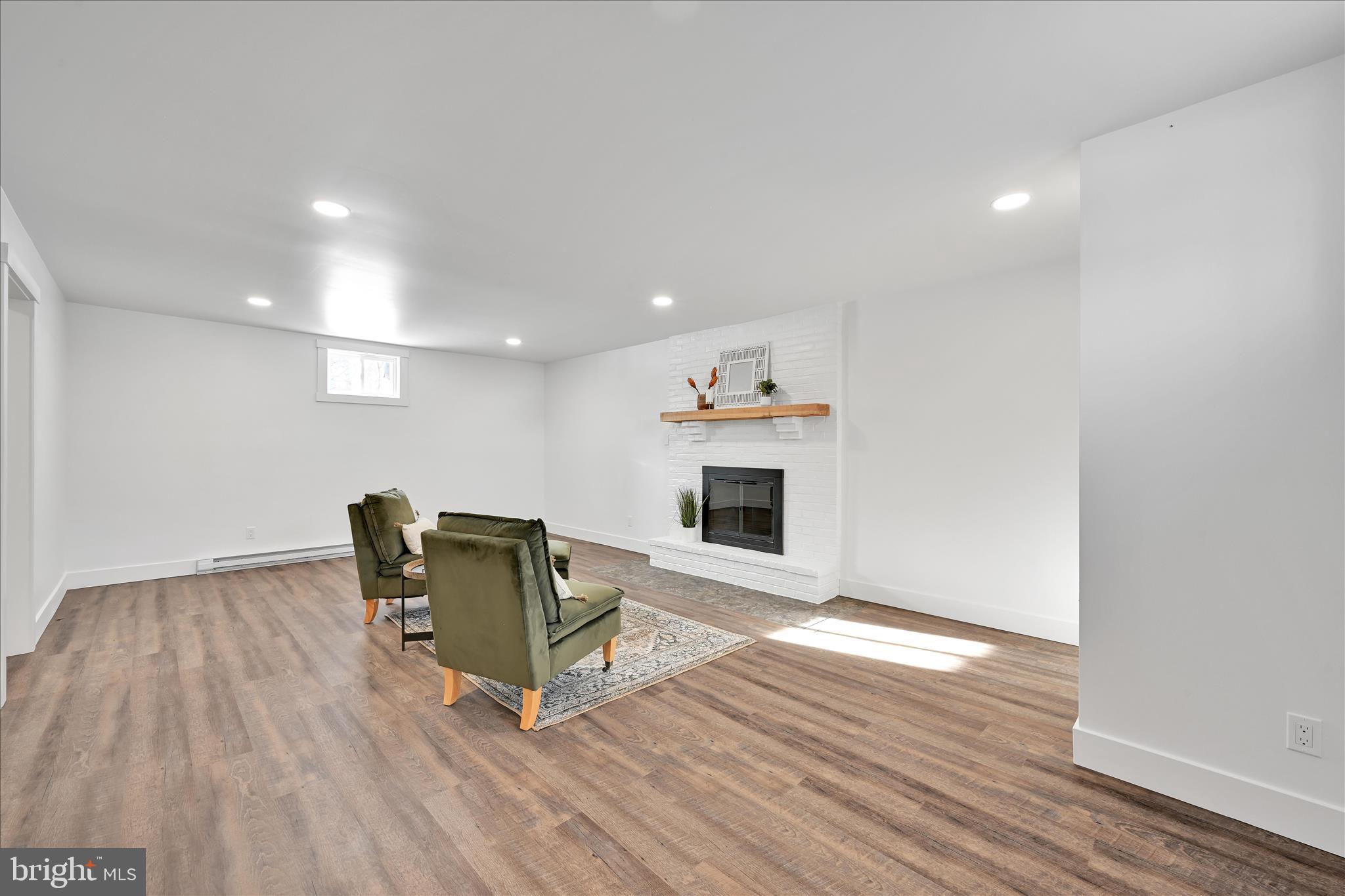 4 Truce Road New Providence, PA 17560 - Photo 15 of 34 a living room with hard wood floors and a fireplace