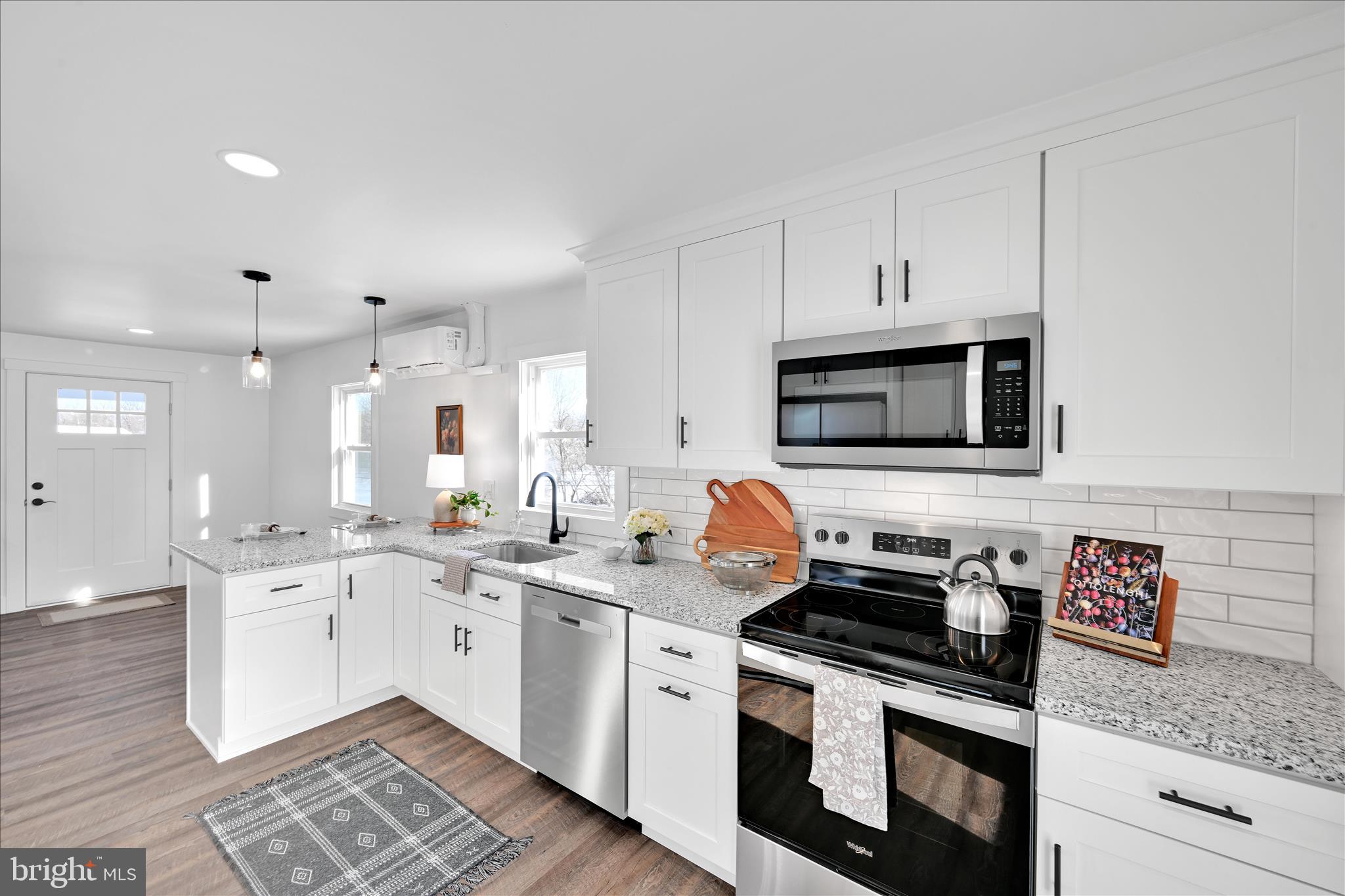 4 Truce Road New Providence, PA 17560 - Photo 7 of 34 a kitchen with stainless steel appliances granite countertop a sink and a stove
