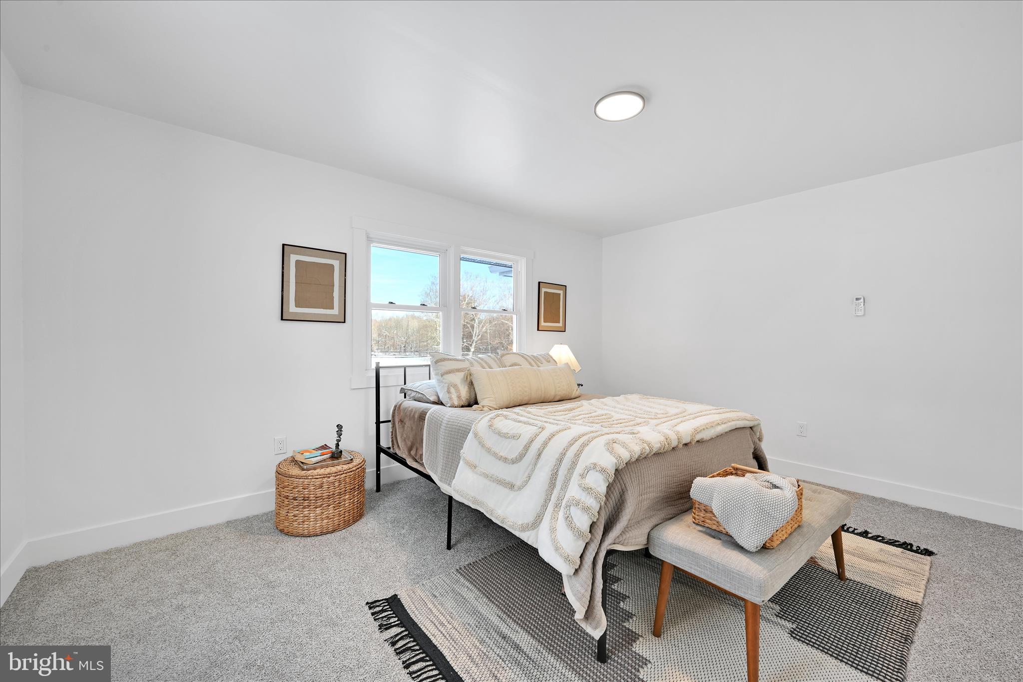 4 Truce Road New Providence, PA 17560 - Photo 9 of 34 a bedroom with a bed and chair