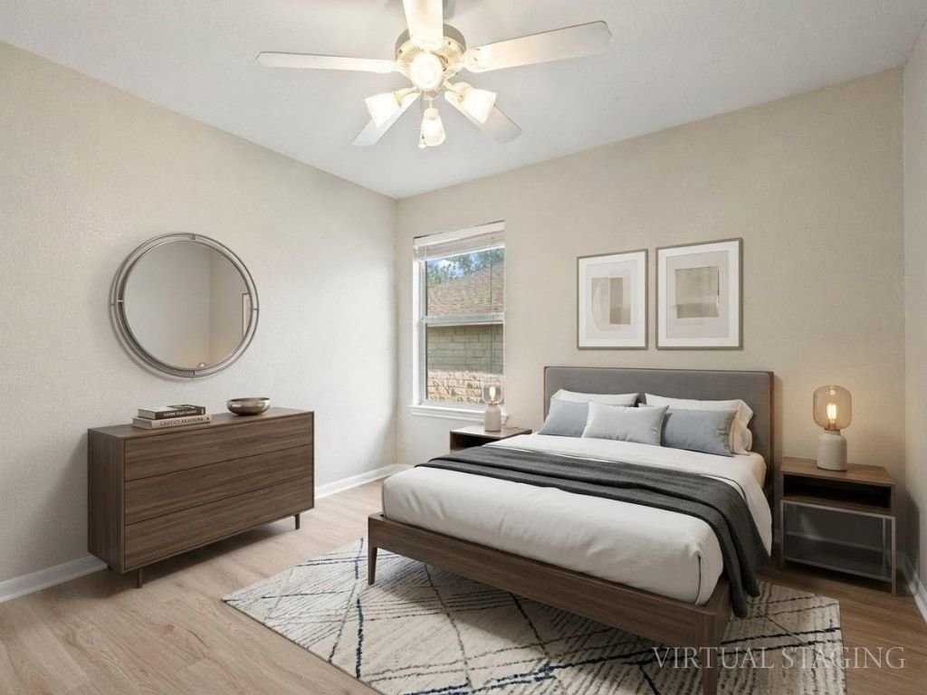 1201 Ridgewood Drive Leander, TX 78641 - Photo 19 of 28 Bedroom featuring ceiling fan and light wood-type flooring