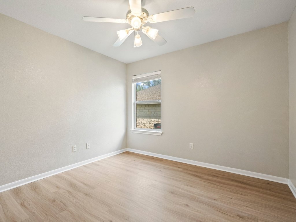 1201 Ridgewood Drive Leander, TX 78641 - Photo 20 of 28 Unfurnished room with light wood-style flooring and ceiling fan