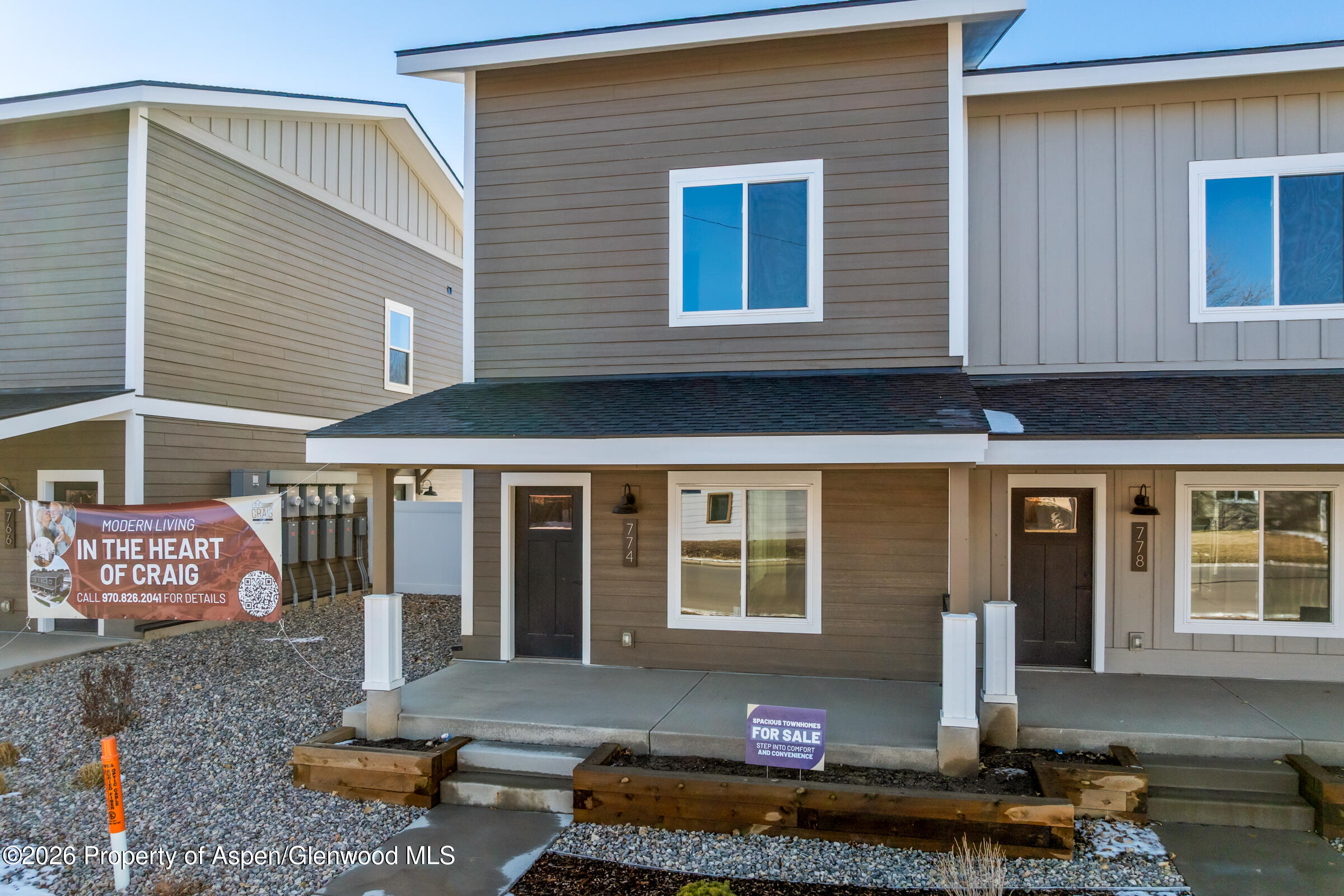 774 Tucker Street Craig, CO 81625 - Photo 1 of 23 a front view of a house with a yard