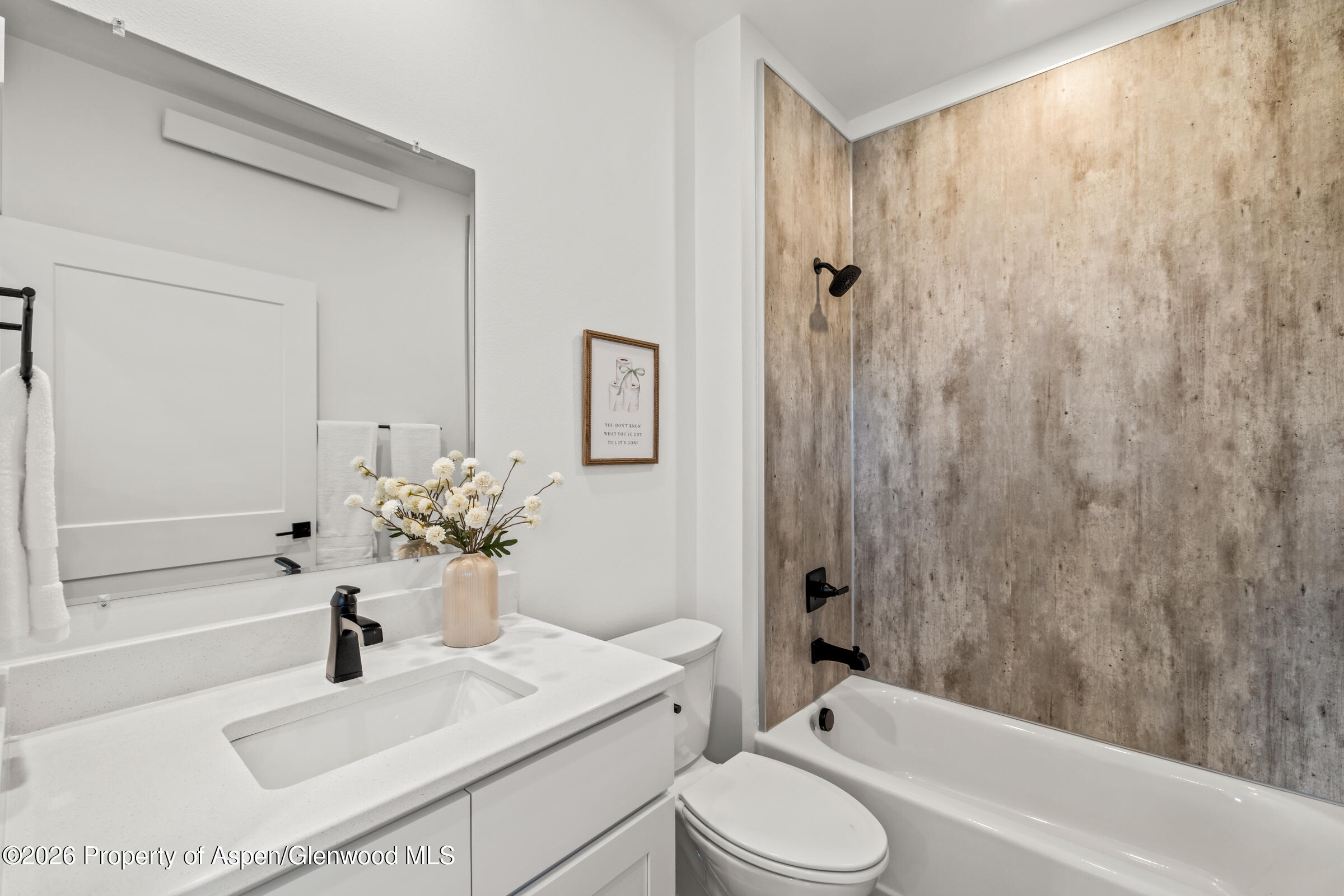 774 Tucker Street Craig, CO 81625 - Photo 16 of 23 a bathroom with a sink a toilet and shower