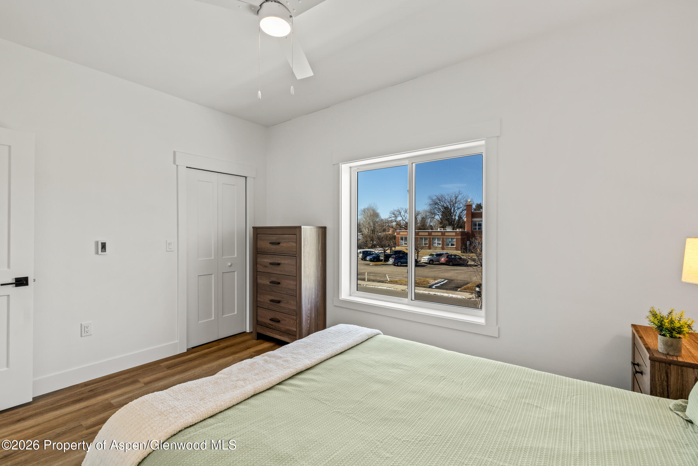 774 Tucker Street Craig, CO 81625 - Photo 18 of 23 a bedroom with a bed and a television in it