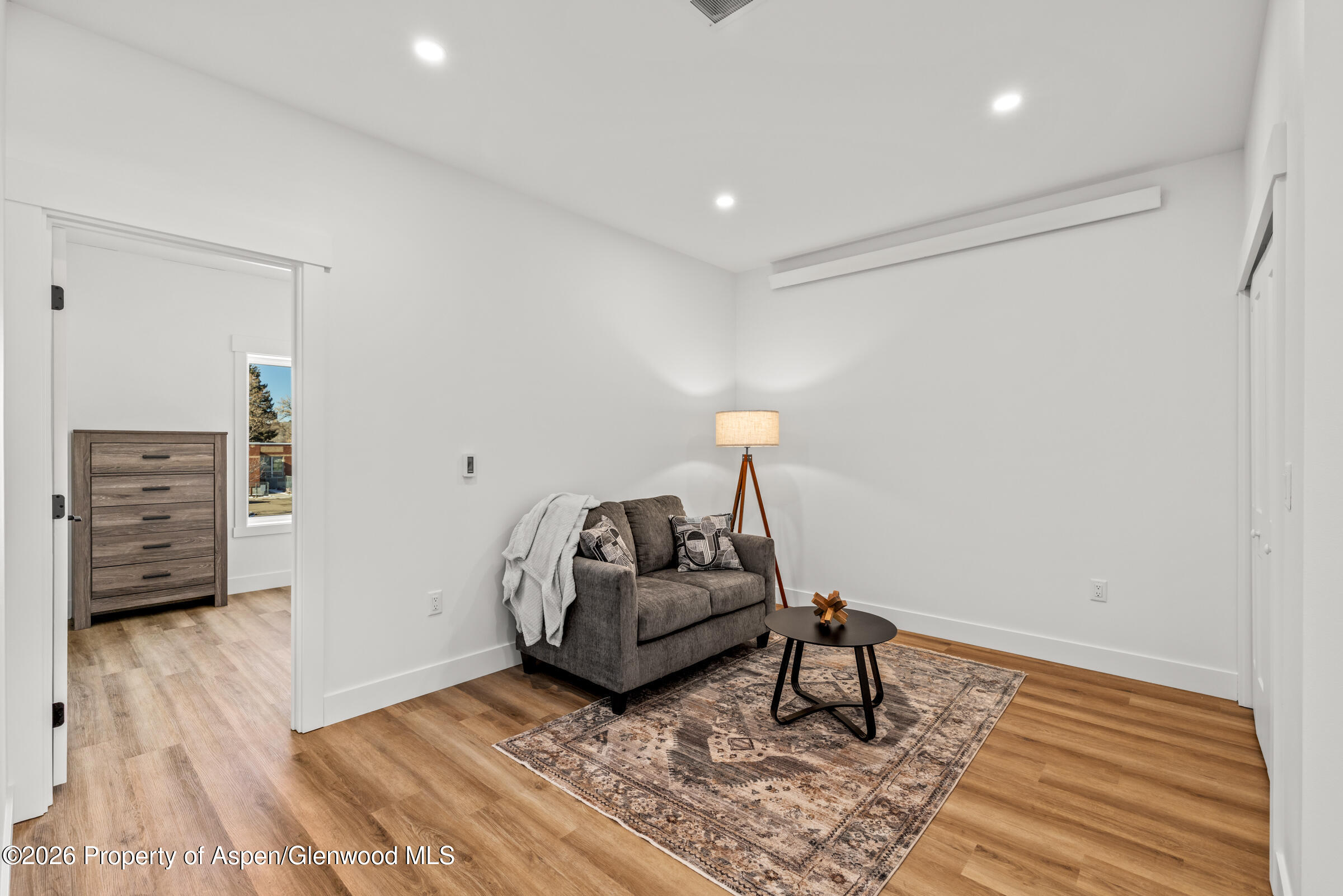 774 Tucker Street Craig, CO 81625 - Photo 19 of 23 a living room with furniture and a wooden floor