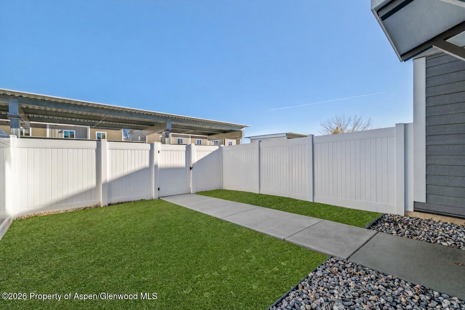 774 Tucker Street Craig, CO 81625 - Photo 23 of 23 a view of a backyard with a garden