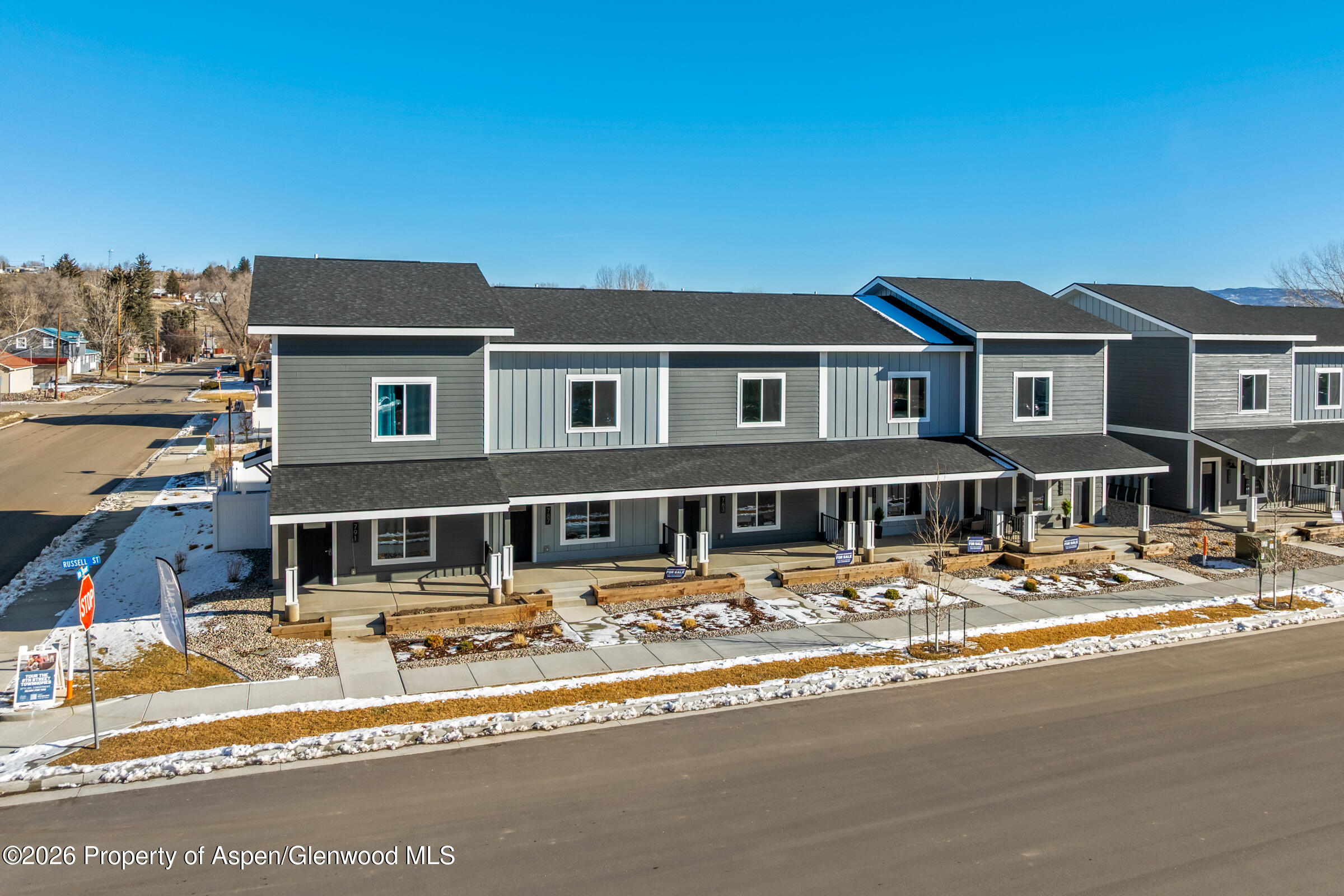 774 Tucker Street Craig, CO 81625 - Photo 3 of 23 a front view of a building with a yard