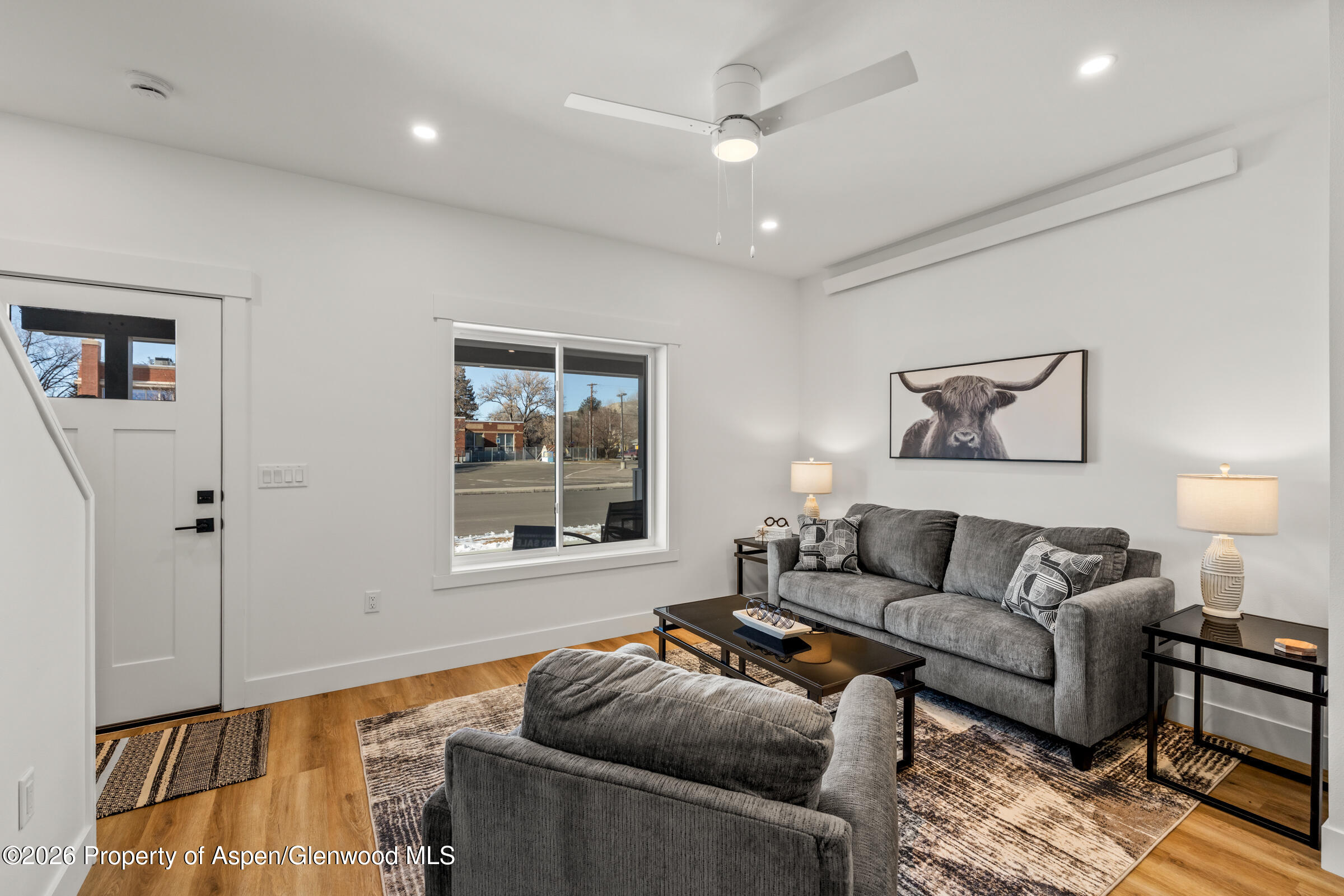 774 Tucker Street Craig, CO 81625 - Photo 6 of 23 a living room with furniture and a window
