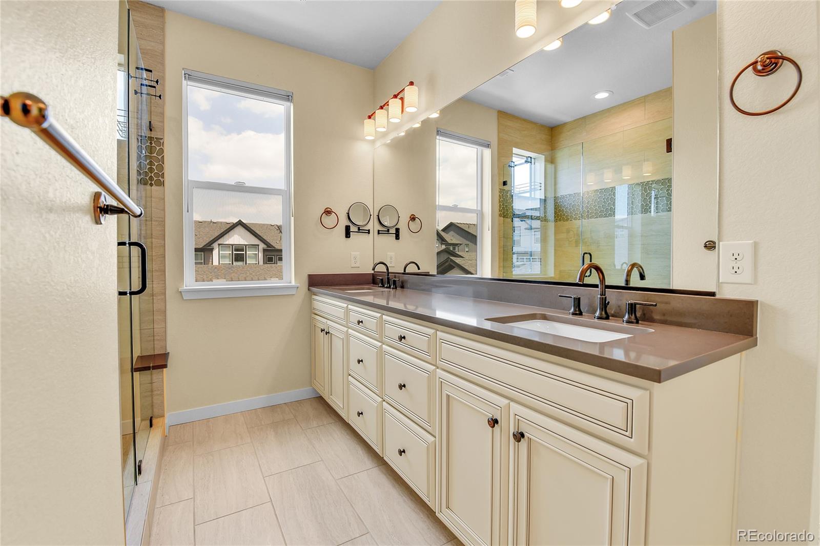 5154 Taft Court Wheat Ridge, CO 80033 - Photo 20 of 44 a bathroom with a sink double vanity and a mirror