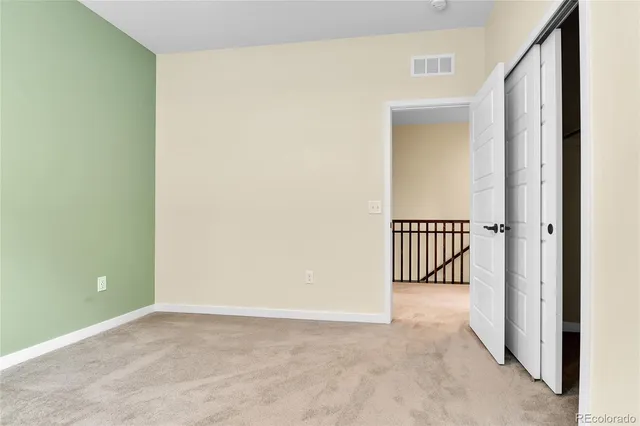 a view of a hallway with a window