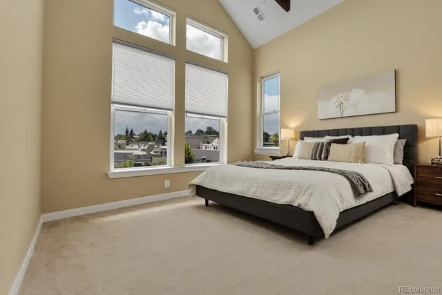 a spacious bedroom with a bed and a window