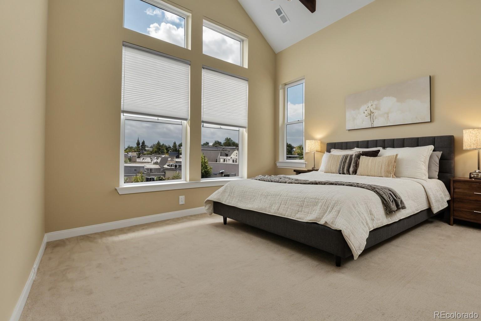 5154 Taft Court Wheat Ridge, CO 80033 - Photo 30 of 44 a spacious bedroom with a bed and a window