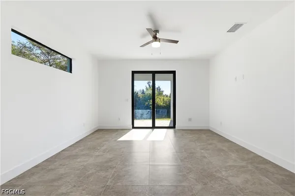 an empty room with a bathroom