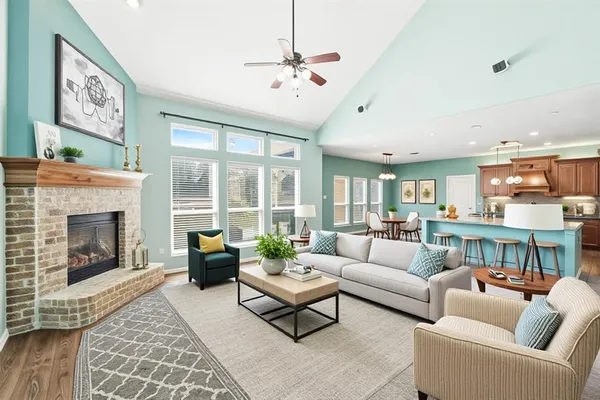 a living room with furniture and a fireplace
