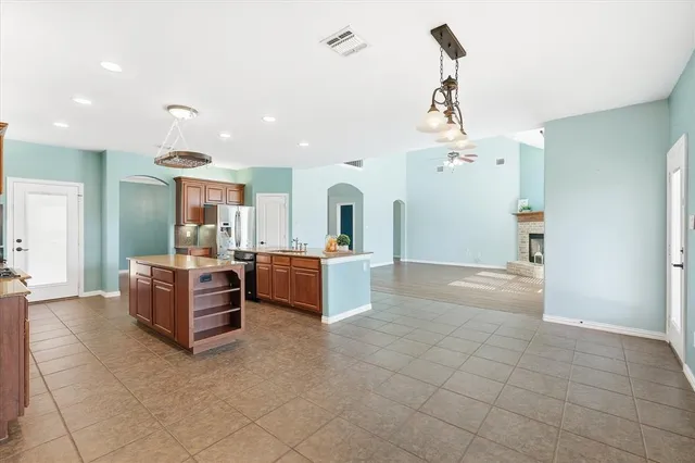 a view of a dining room with furniture wooden floor and chandelier
