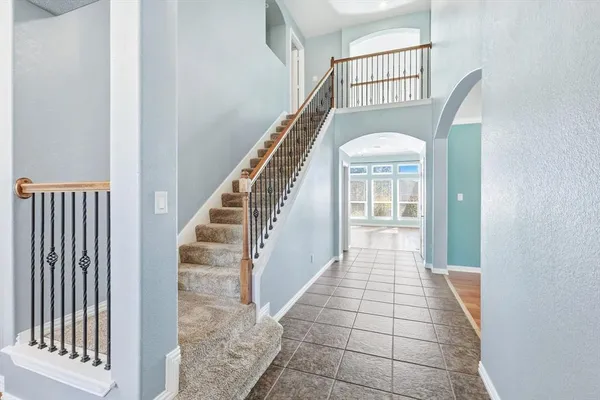 a view of a hallway with windows