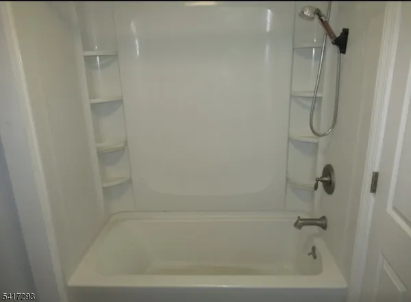 a close view of a bathtub in bathroom