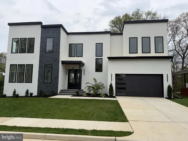 a kitchen with stainless steel appliances granite countertop a sink a stove and a wooden floors