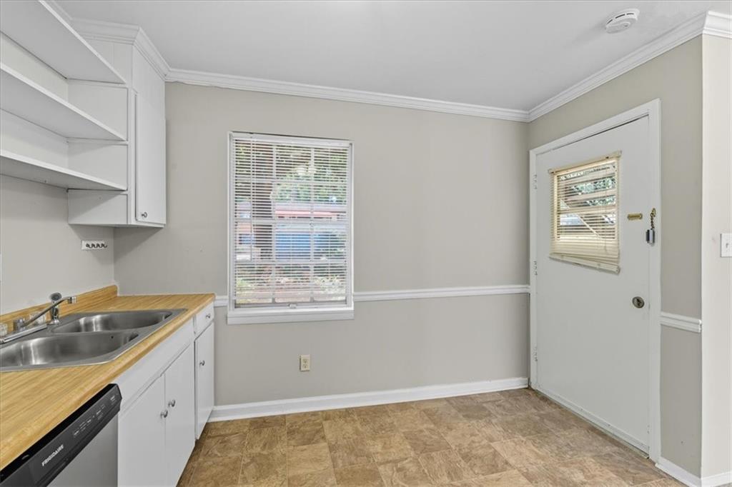 2427 Lawrenceville Highway, Unit 4B Decatur, GA 30033 - Photo 13 of 22 a kitchen with a sink cabinets and window