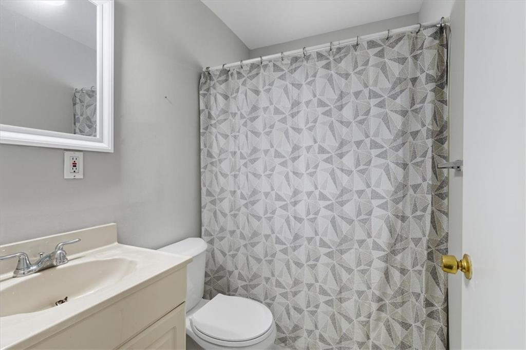 2427 Lawrenceville Highway, Unit 4B Decatur, GA 30033 - Photo 17 of 22 a bathroom with a toilet and a sink