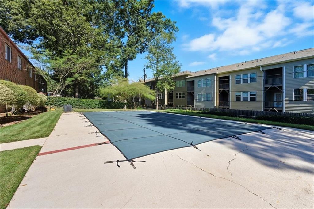 2427 Lawrenceville Highway, Unit 4B Decatur, GA 30033 - Photo 21 of 22 a view of a white house with a yard