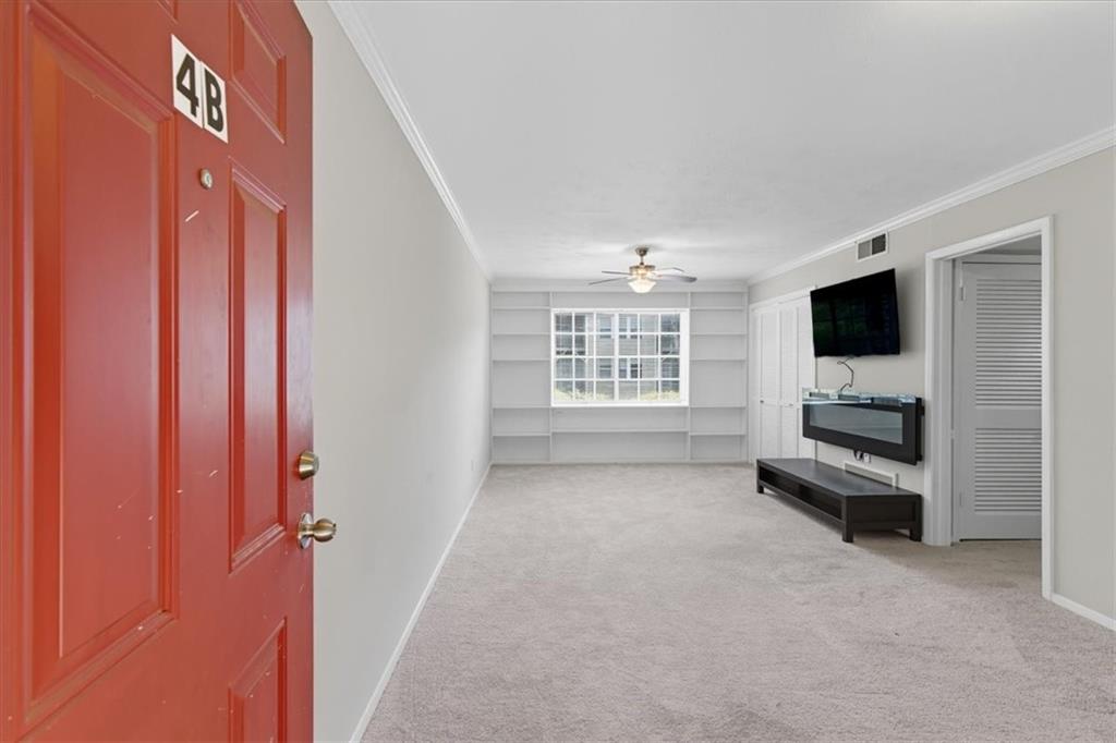 2427 Lawrenceville Highway, Unit 4B Decatur, GA 30033 - Photo 5 of 22 a view of livingroom with kitchen