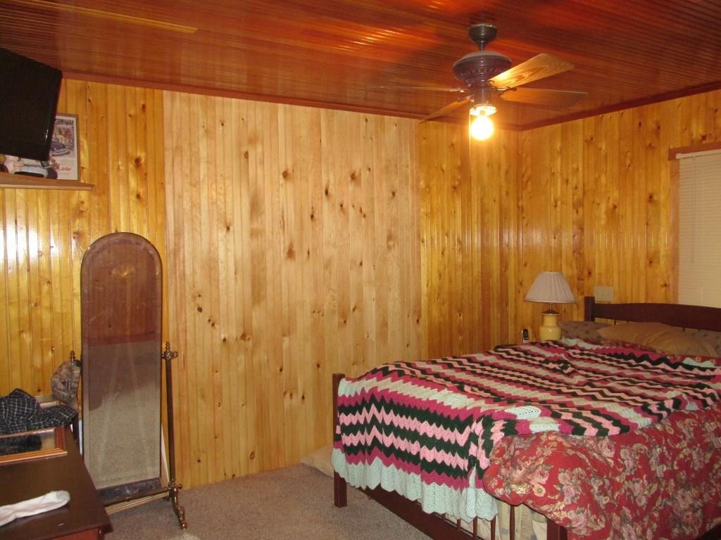 54 Crocker Road Belfast, ME 04915 - Photo 14 of 34 Master bedroom with wood walls and...