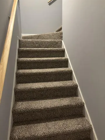 a view of staircase with empty racks