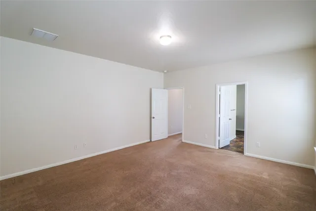 a bathroom with a tub and shower