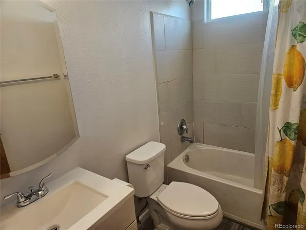 a bathroom with a sink toilet and bathtub