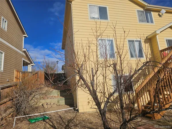 a view of a house with a large tree